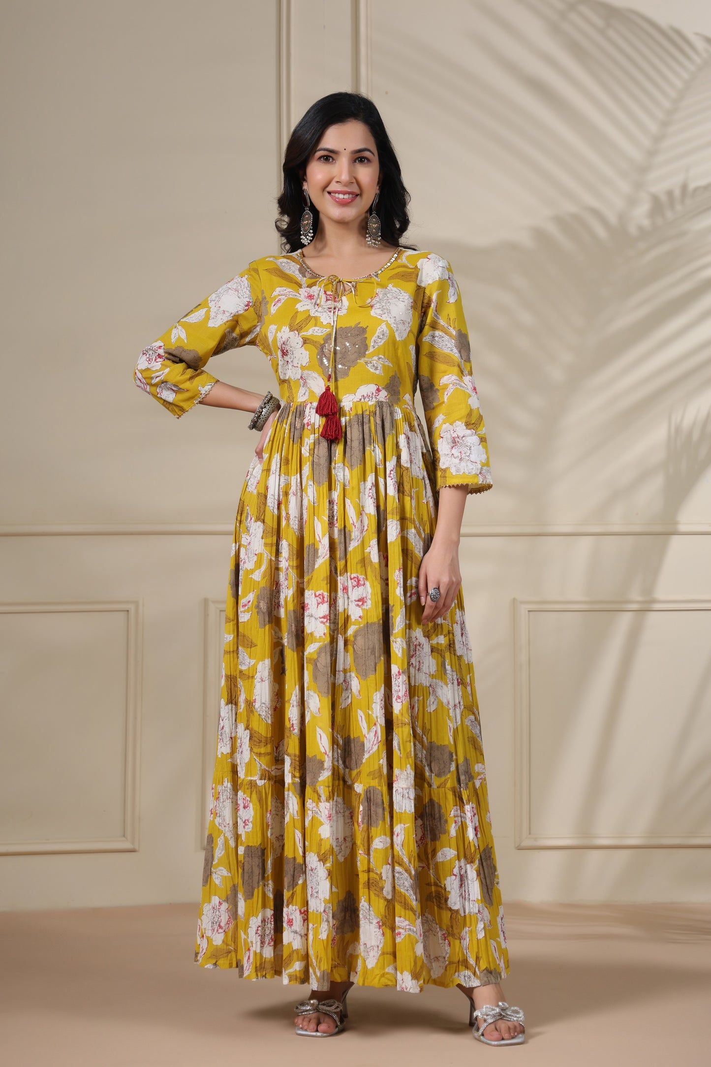 PUKHYA MUSTARD PRINTED FLARED GOWN WITH ADDA WORK, LACE AND DORI, TUSSLE