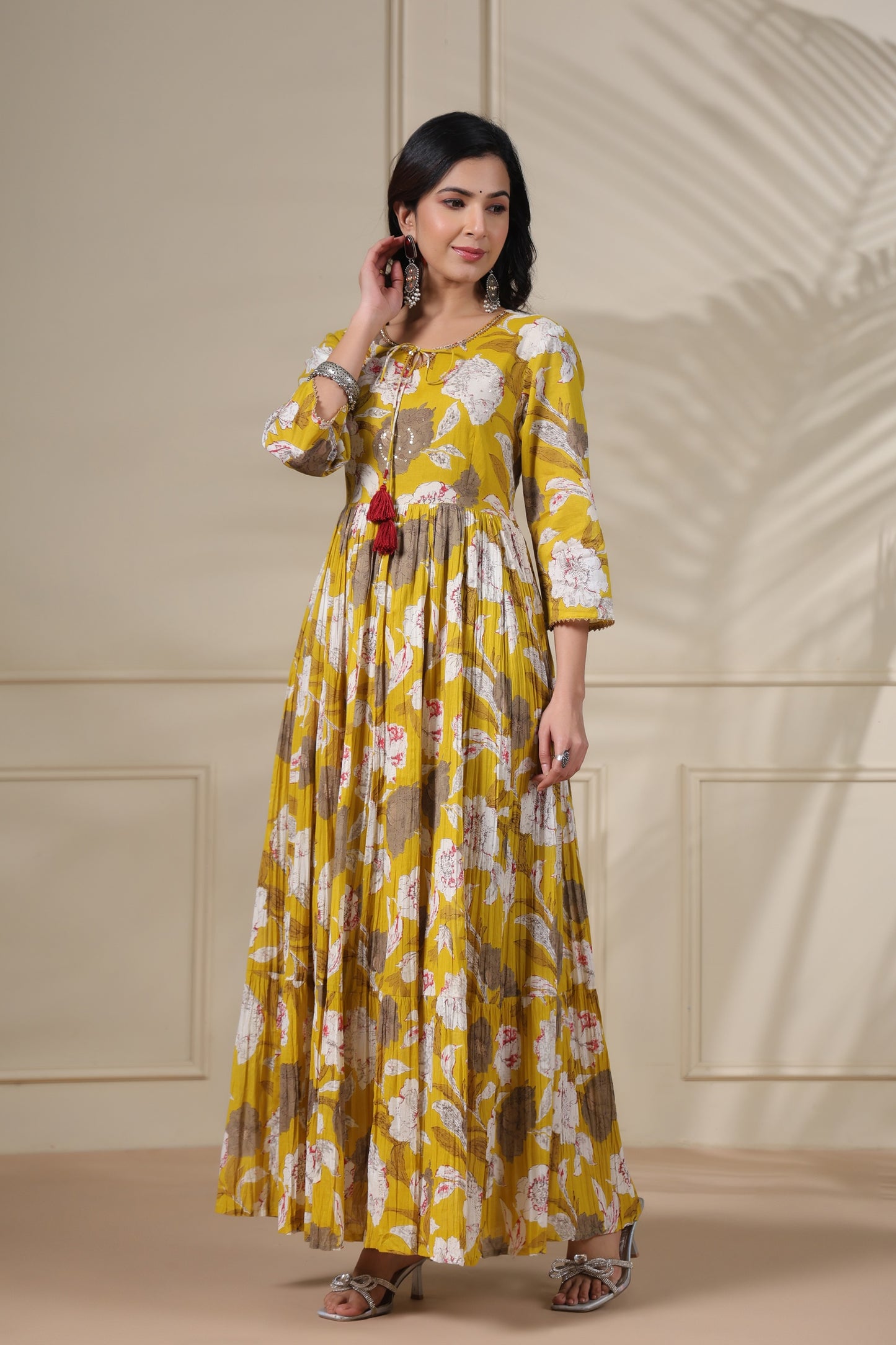 PUKHYA MUSTARD PRINTED FLARED GOWN WITH ADDA WORK, LACE AND DORI, TUSSLE