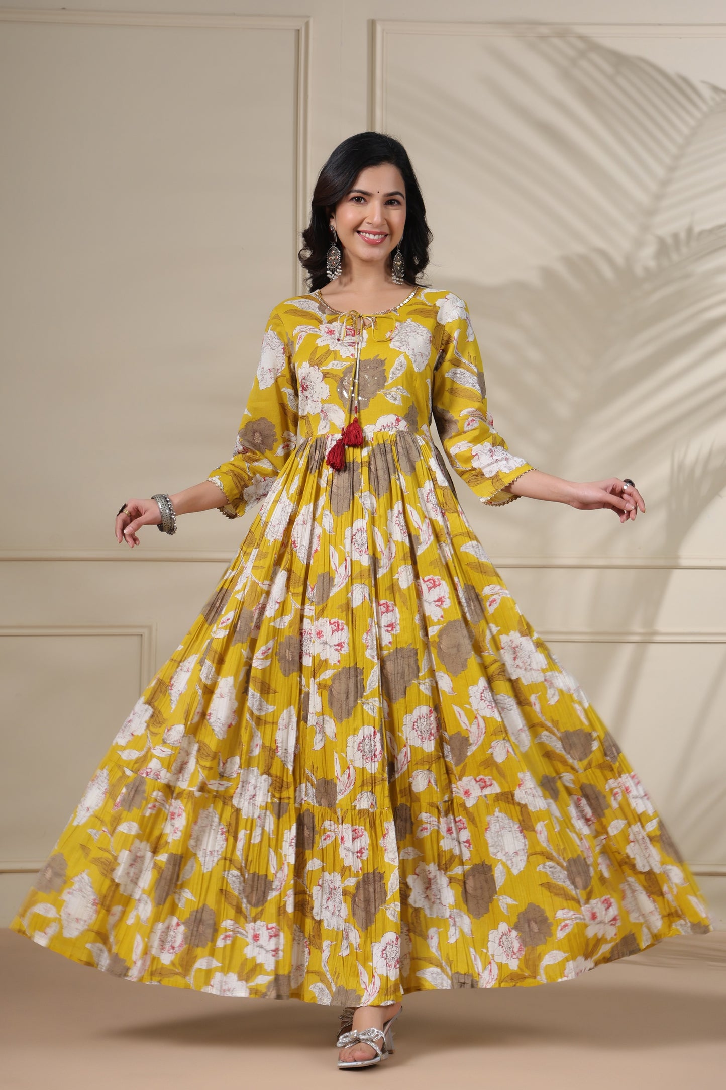 PUKHYA MUSTARD PRINTED FLARED GOWN WITH ADDA WORK, LACE AND DORI, TUSSLE